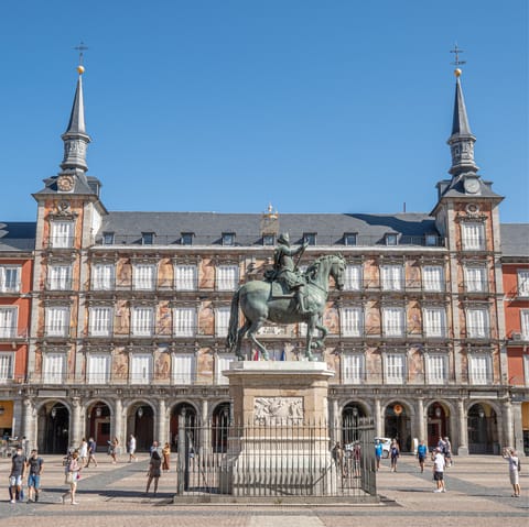 Visit local cafes and see street performers at the bustling Plaza Mayor