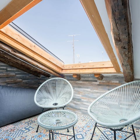 Sip a cafe con leche under the skylight with views of the city