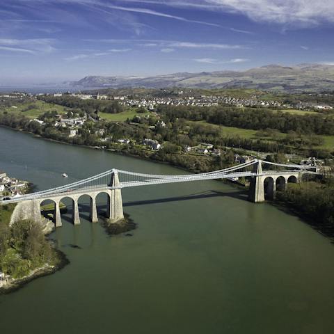 Cross the iconic Menai Bridge to your home
