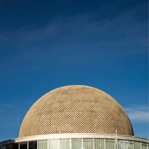 Visit the Madrid Planetarium, a short drive away