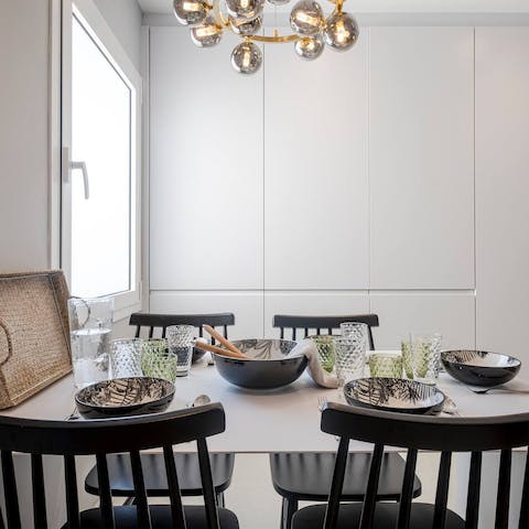 Gather together for a celebratory meal at the chic dining table