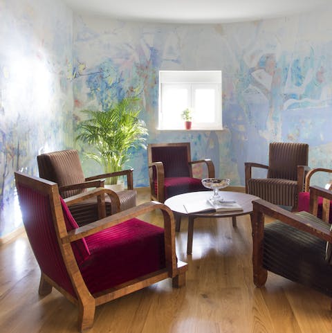 The unusual wall painting makes this sitting room a focal point of the home