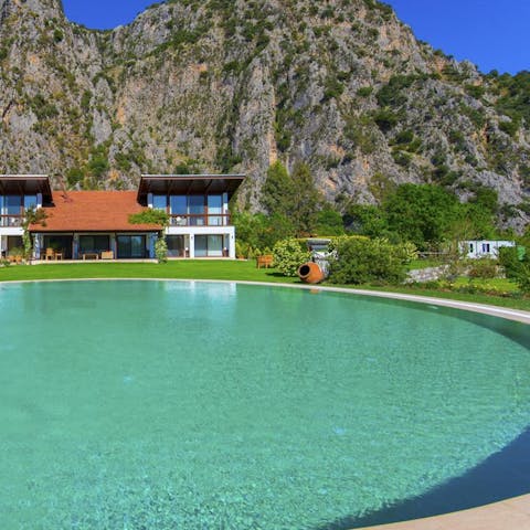 Take a dip with a breathtaking mountainous backdrop