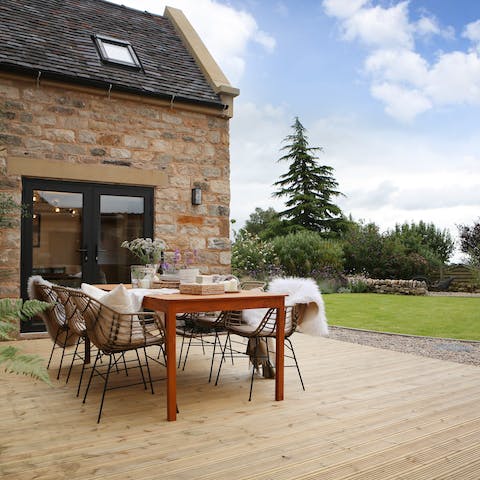 Dig into a homemade cottage pie on the terrace while the kids play in the garden