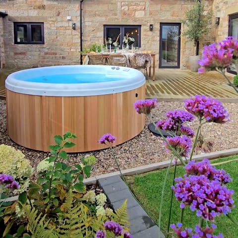 Enjoy a long soak in the private hot tub