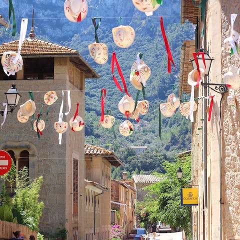 Drive down the hill to explore the coastal village of Deià