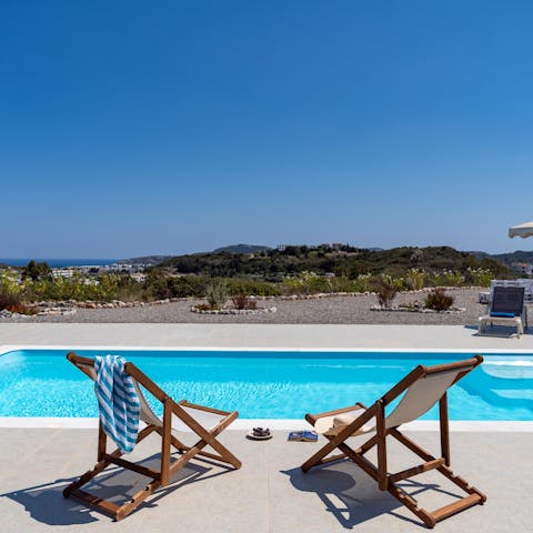 Relax in a deck chair with an ice-cold drink before plunging into your private pool