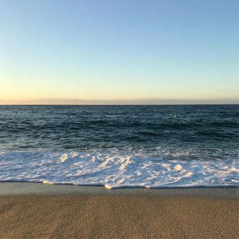 Sink your feet into the sand at Lagoa de Albufeira beach