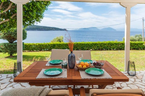 Wake up to breakfast on the terrace overlooking the Ionian Sea