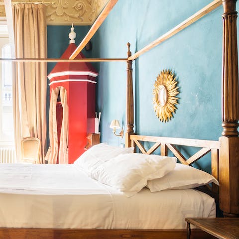 Fall asleep in the sumptuous four-poster bed
