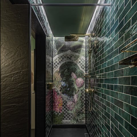 Step into the rainfall shower after a busy day of sightseeing