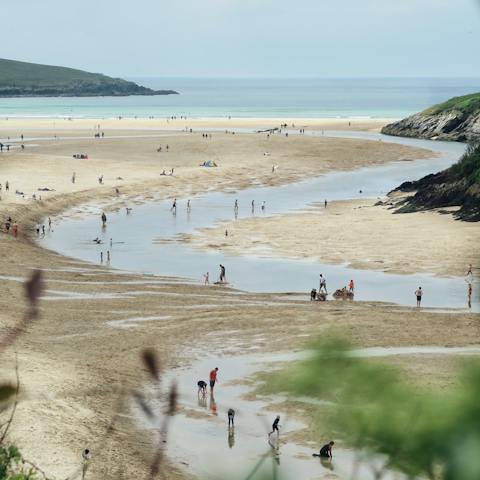 Don your wetsuit and paddle across the estuary waters to Crantock Beach