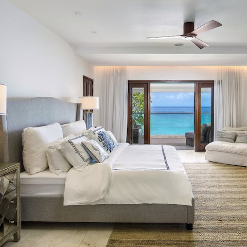 Soak up uninterrupted views of the ocean from your sumptuous bedroom