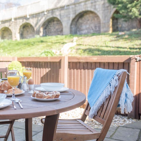 Enjoy your breakfast alfresco and admire the ancient stone walls from the patio