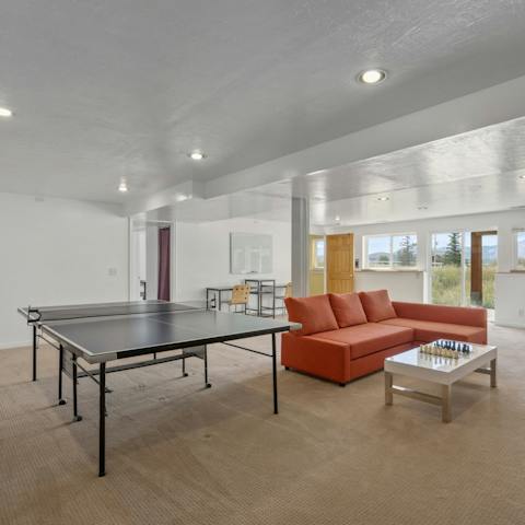Challenge friends to a game of table tennis in the downstairs games room