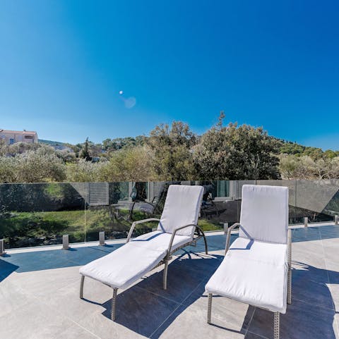 Settle into a lounger on the sun-trap terrace and while away the day