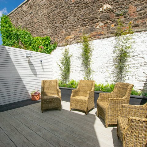 Sun yourself out in the cute courtyard garden