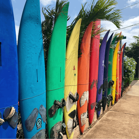 Try your hand surfing at the beach outside