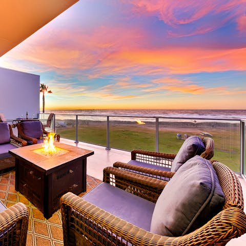 Relax around the fire pit with views of the Pacific