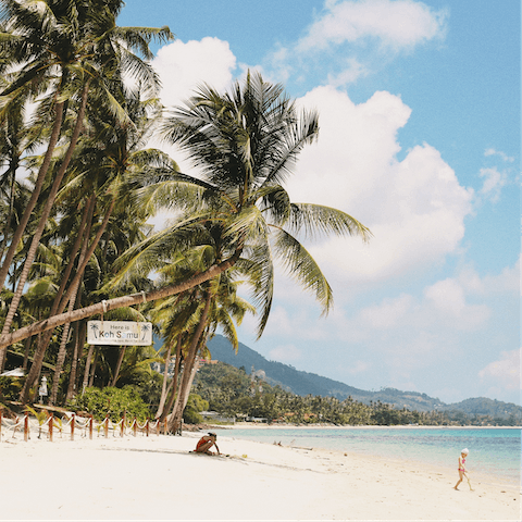 Splash about in the shallow waters of Baan Tai Beach