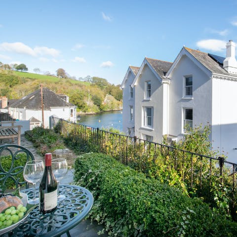 Relax on the terrace while taking in the river views