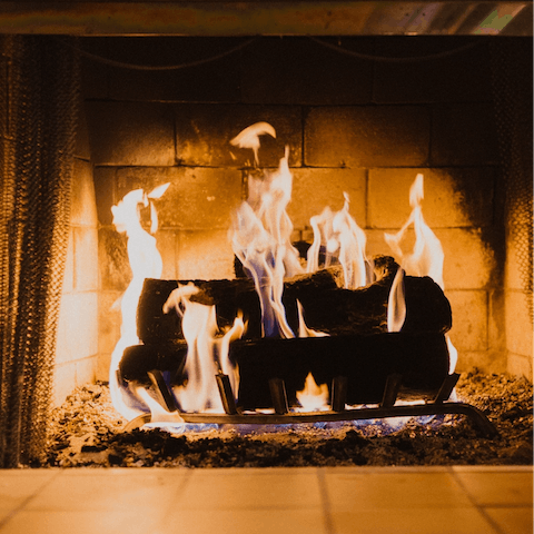 Snuggle up beside the glow of the fireplace