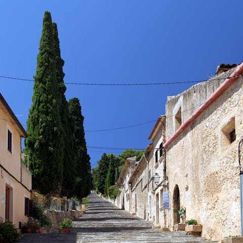 Explore the cobbled streets of Pollença's Old Town, a short drive away