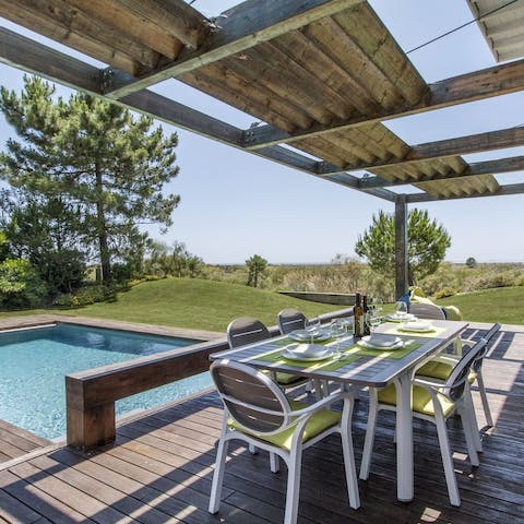 Dine alfresco beside the pool