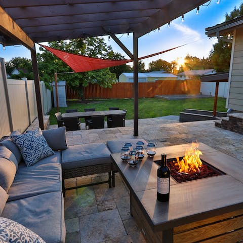 Share stories around the firepit in the enclosed backyard