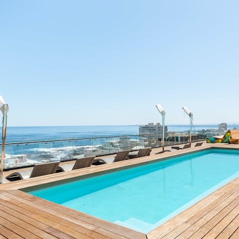 Take in the ocean views from the shared roof terrace and pool