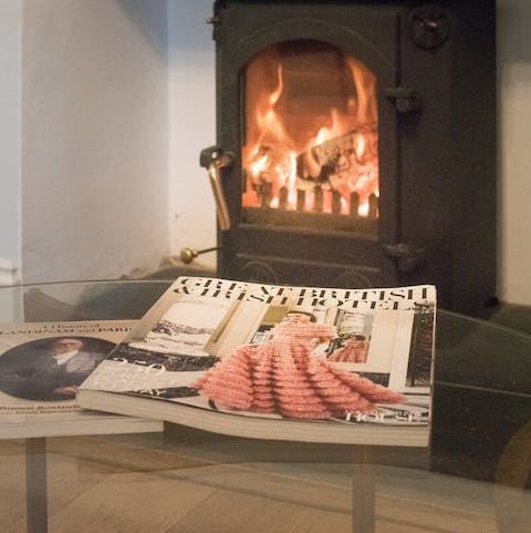 Curl up with a good book or a flick through a magazine by the roaring fireplace