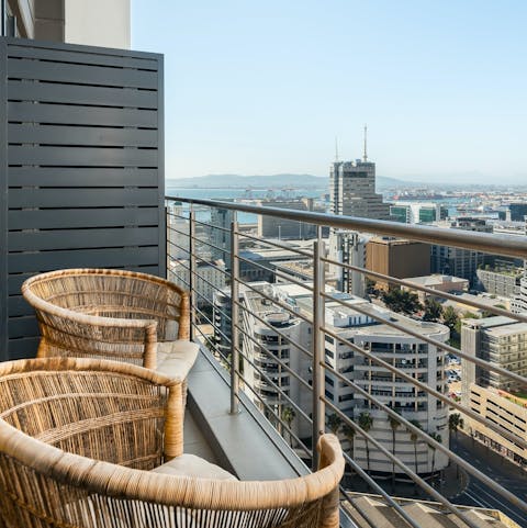 Admire the mountain and city vistas from the private balcony