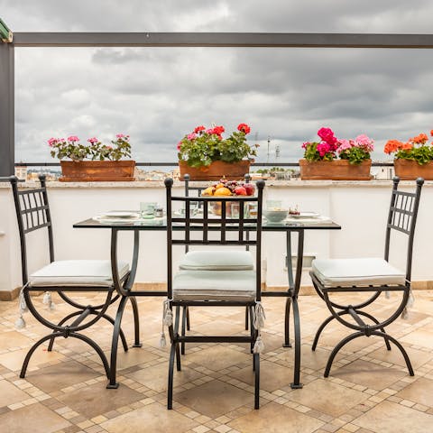 Sit down to a celebratory alfresco meal on the terrace while feasting on views of Rome's rooftops