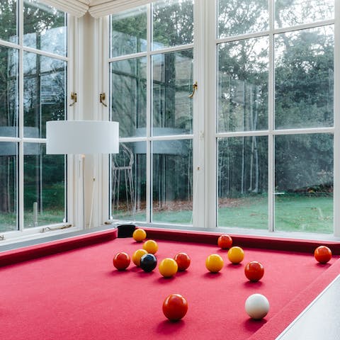 Challenge friends and family to a game of pool in the sunroom – winner stays on, of course