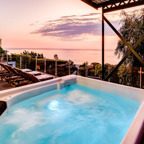 Take up residence in the hot tub just as the sun begins to set