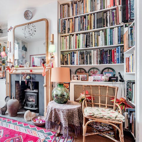 Find something that takes you fancy on the bookshelves and kick back on the sofa