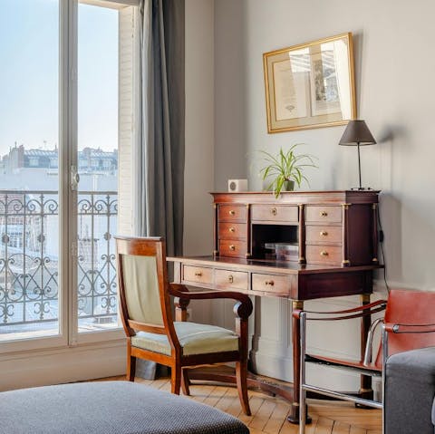 Get some work done at the antique desk in the window