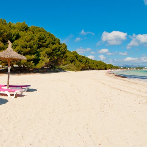 Spend relaxing days down on Playa de Alcudia, just 300m away