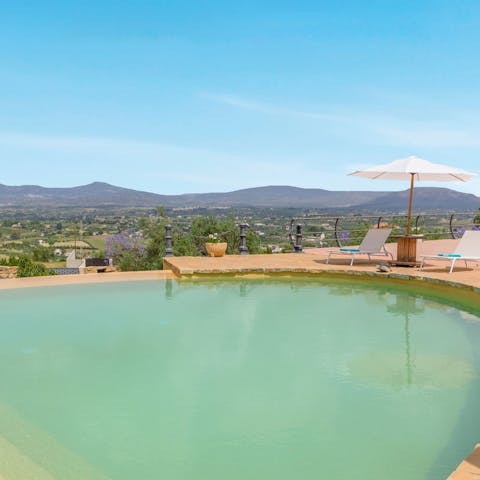 Gaze out over the mountains and endless plains from the pool terrace