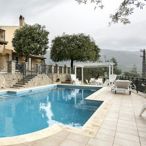 Spend an afternoon by the pool soaking in the majestic mountain scenery