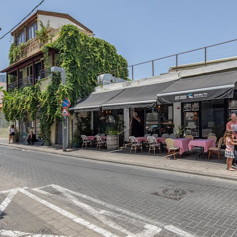 Explore the pavement cafes of Neve Tzedek, a five-minute stroll away