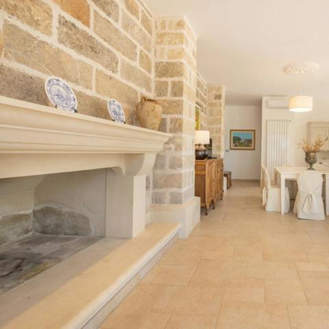 Enjoy ancient architectural touches like the open hearth in the living room