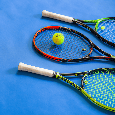 Go for a game of tennis or pickleball on the professional court, striped for both games