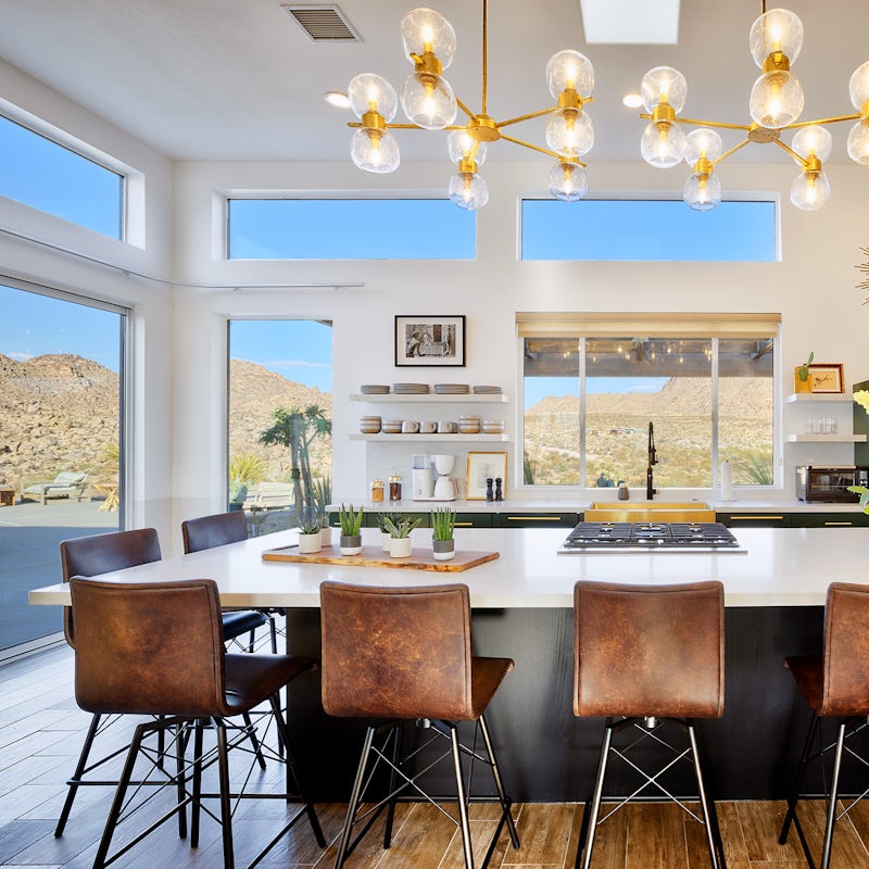 Sit at the twelve-foot island in the gourmet kitchen, surrounded by large windows to let in natural light