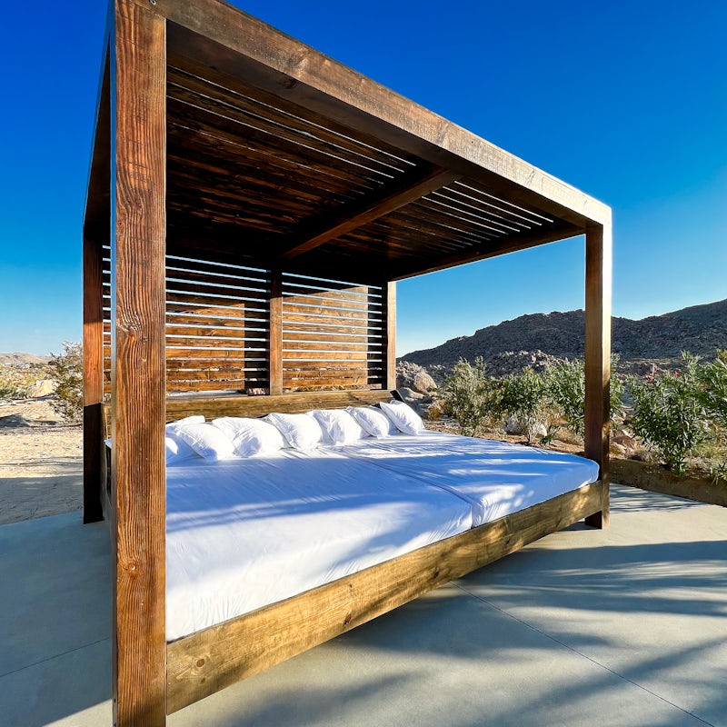Lounge in the shade of the four-poster double queen daybed and be comfier than you've ever been before