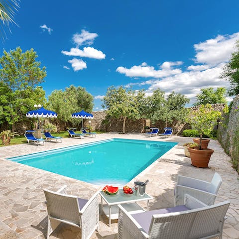 Spend sun-soaked days lounging beside the pool 