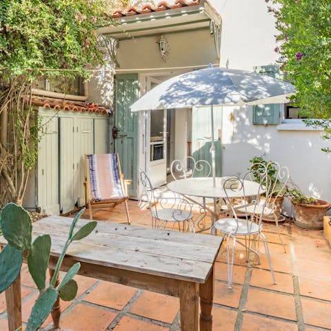 Sip a morning cup of coffee on the truly charming garden patio area