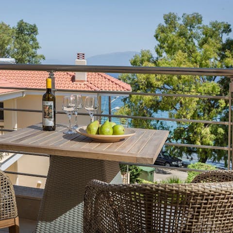 Sip local wine on your balcony as you gaze out to sea and mountain views