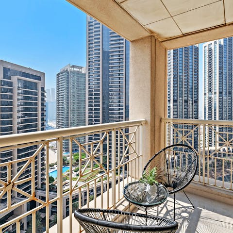 Take your morning coffee on your private balcony with panoramic views of the famous cityscape