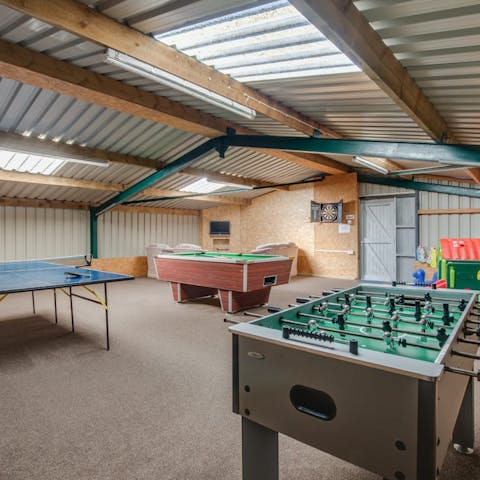 Hang out in the games room, with a pool table, football table and ping pong table